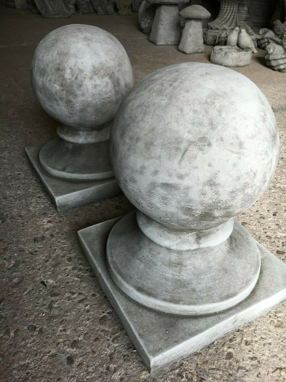Stone Garden Finial - Stunning Stone Ball | Durable Design. Two durable round grey stone finials with square bases, suited for outdoor garden decor.