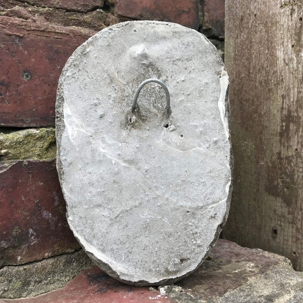 Back of Funny Stone Garden Plaque - Garden Wall Plaque featuring built-in metal hook for easy hanging on outdoor brick or wooden surfaces.