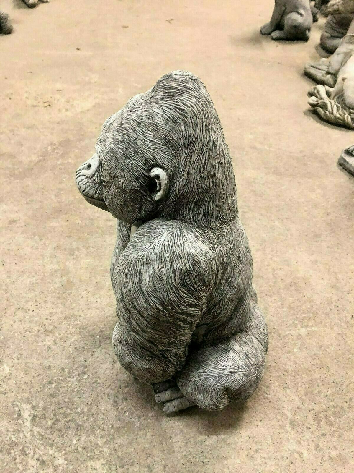 Limestone-finished Gorilla Statue with realistic fur detailing, left profile view ideal for patios or lawn ornamentation.
